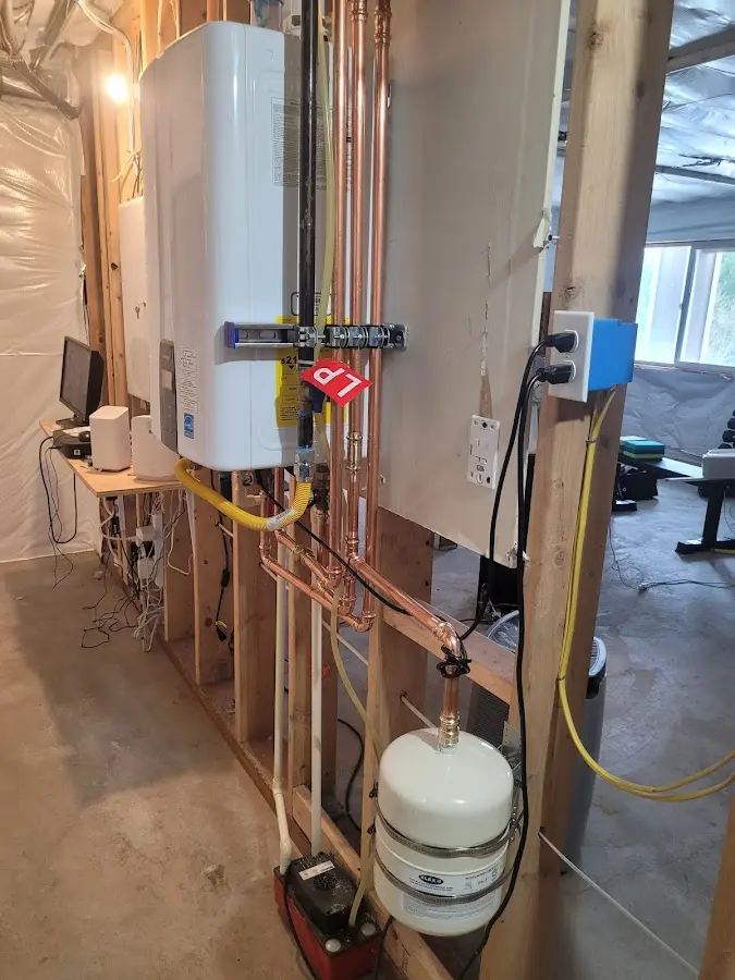 Licensed plumber repairing a kitchen sink in Brooklyn Park
